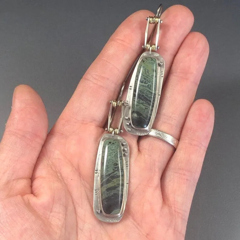 Two-colour marble pattern geometric alloy earrings showing geometric shape and two-tone surface design