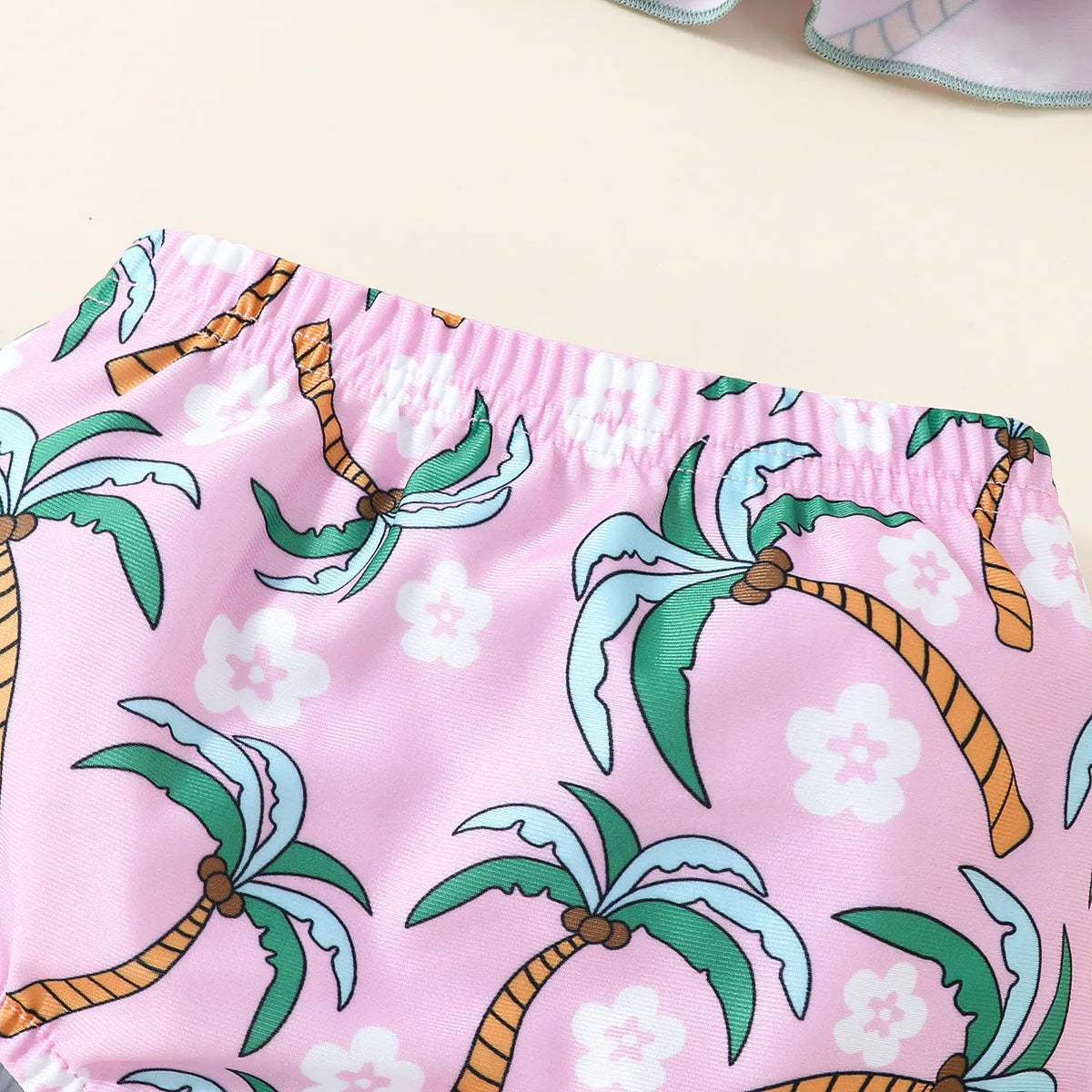 White two-piece toddler swimsuit set with shirt and shorts for beachwear