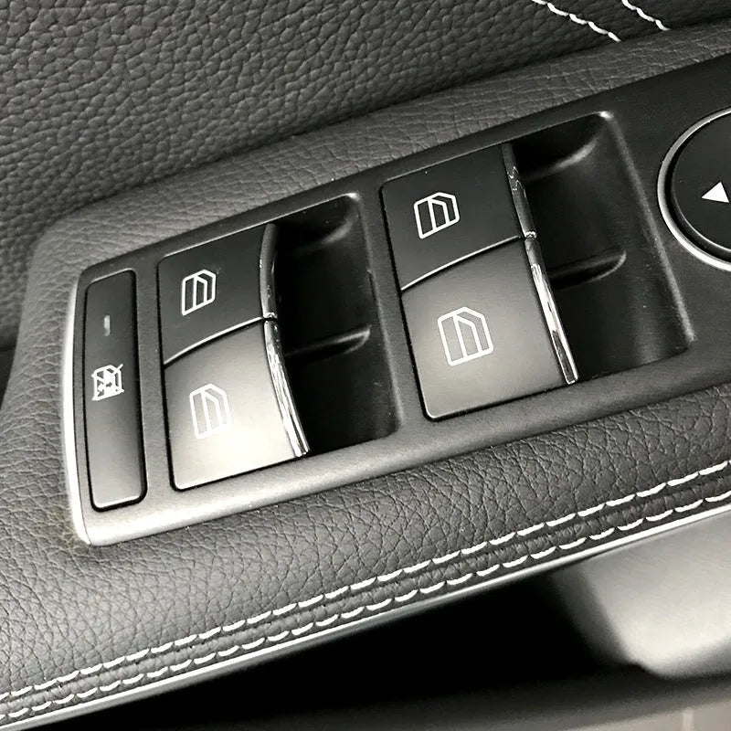 Black glitter decorative sticker for car window lift button modification on a dark background.