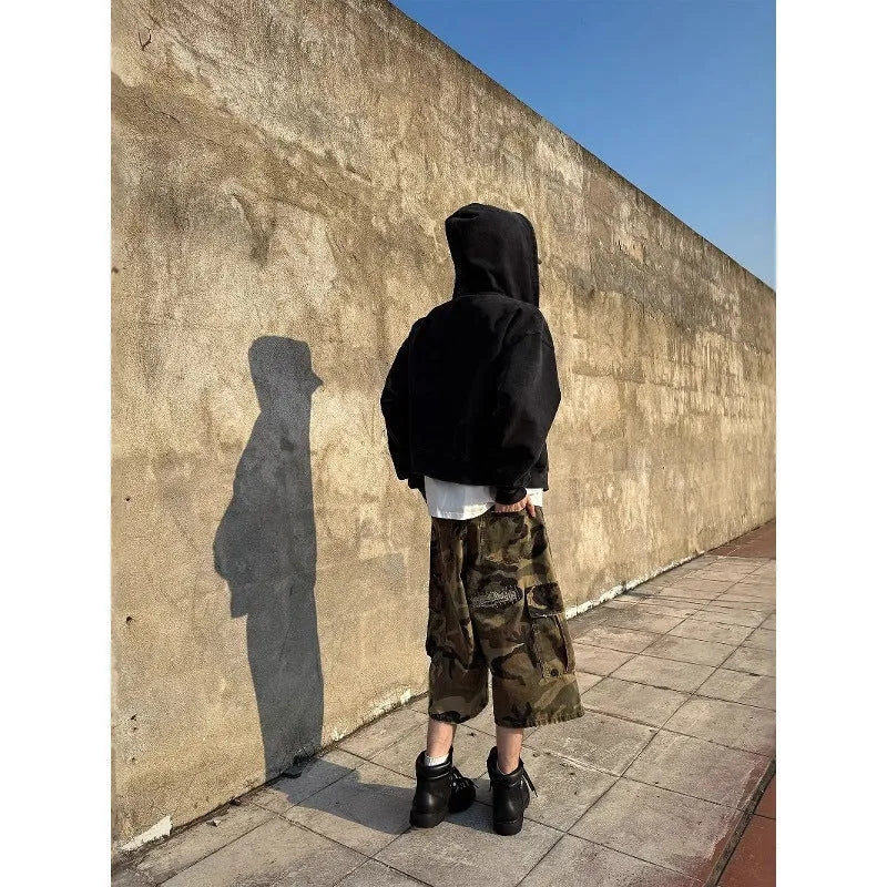 Men's camouflage cropped jeans with patchwork and ripped details in loose straight cut