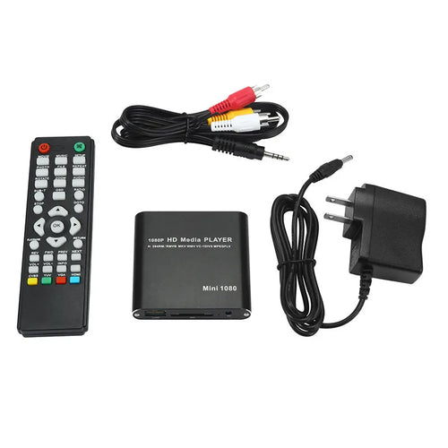 Compact black and blue all-metal 1080p HD media player with remote control on a wooden surface.