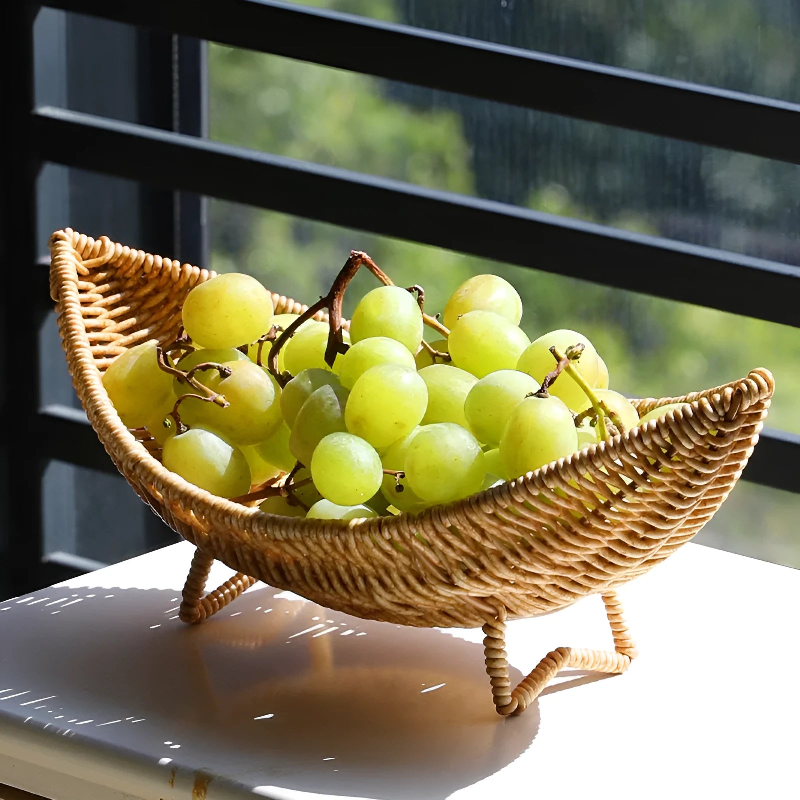 Plastic knitted basket fruit plate with dim sum snacks and melon seeds on a desktop