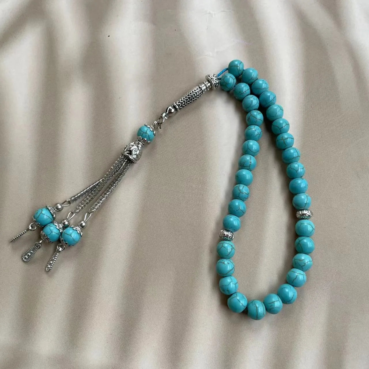 Handmade Muslim worship bracelet with sky blue 8mm stone beads for daily dhikr reminders.