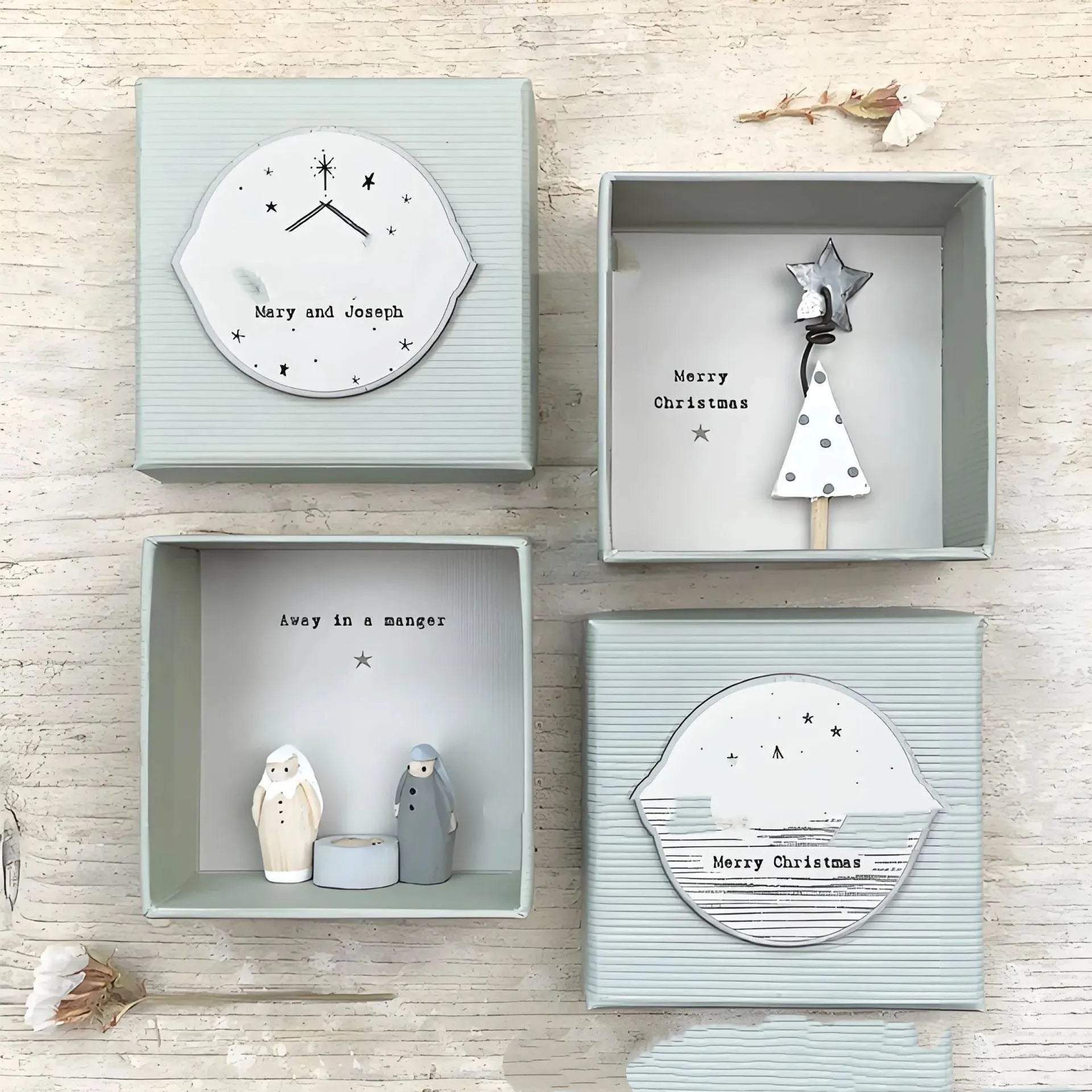 Boxed resin and plastic guardian angel figurine ornament in a modern cartoon style.
