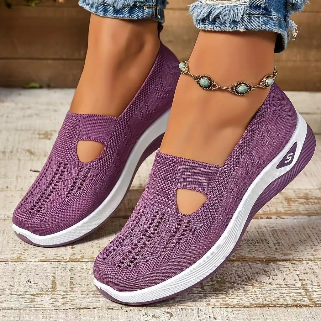 Women's solid colour mesh T-strap casual shoes with flat heel and round toe.