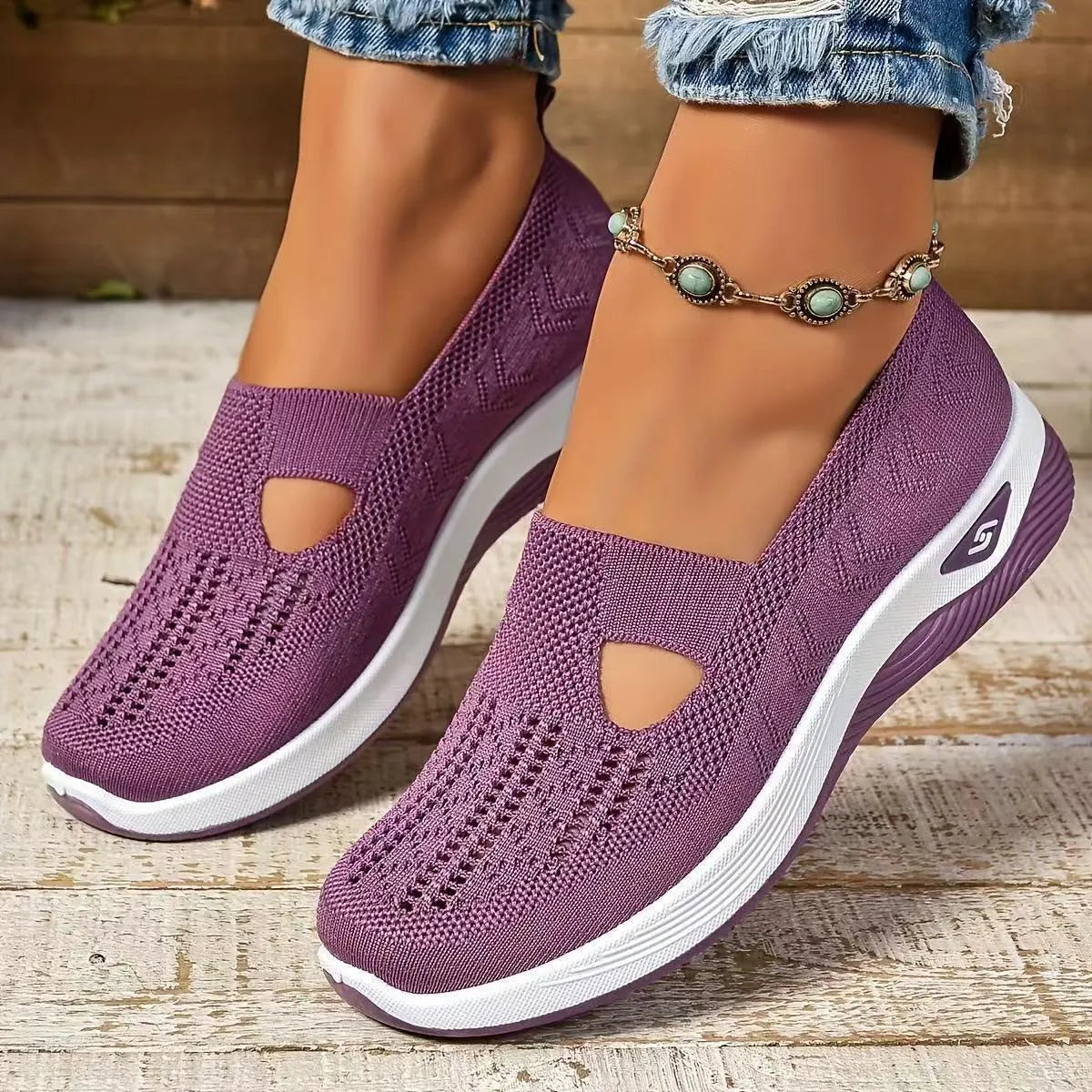 Women's solid colour mesh T-strap casual shoes with flat heel and round toe.