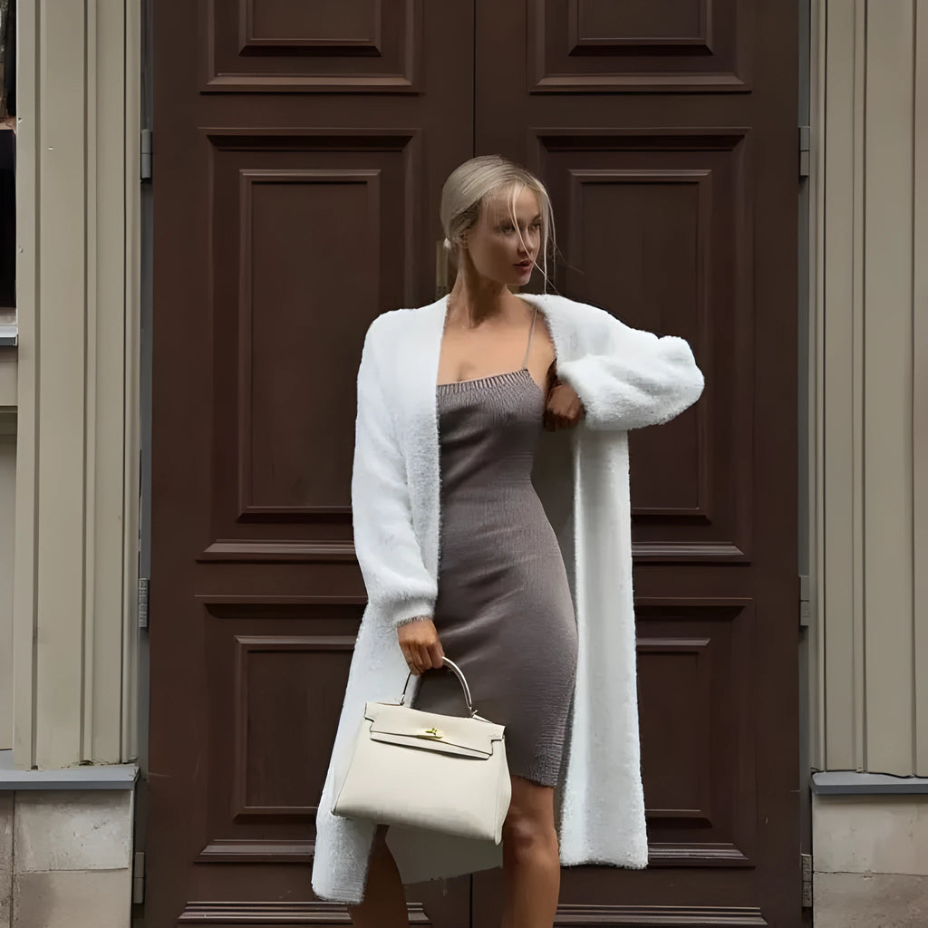 White women's knitted cardigan jacket with extended length and loose fit
