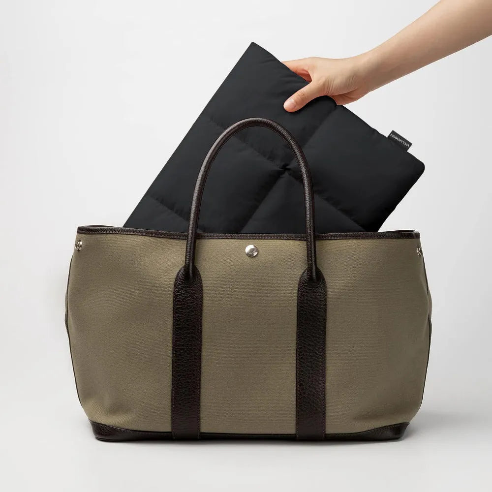 Soft fluffy polyester laptop sleeve in black or khaki with sewing thread detailing and four size options