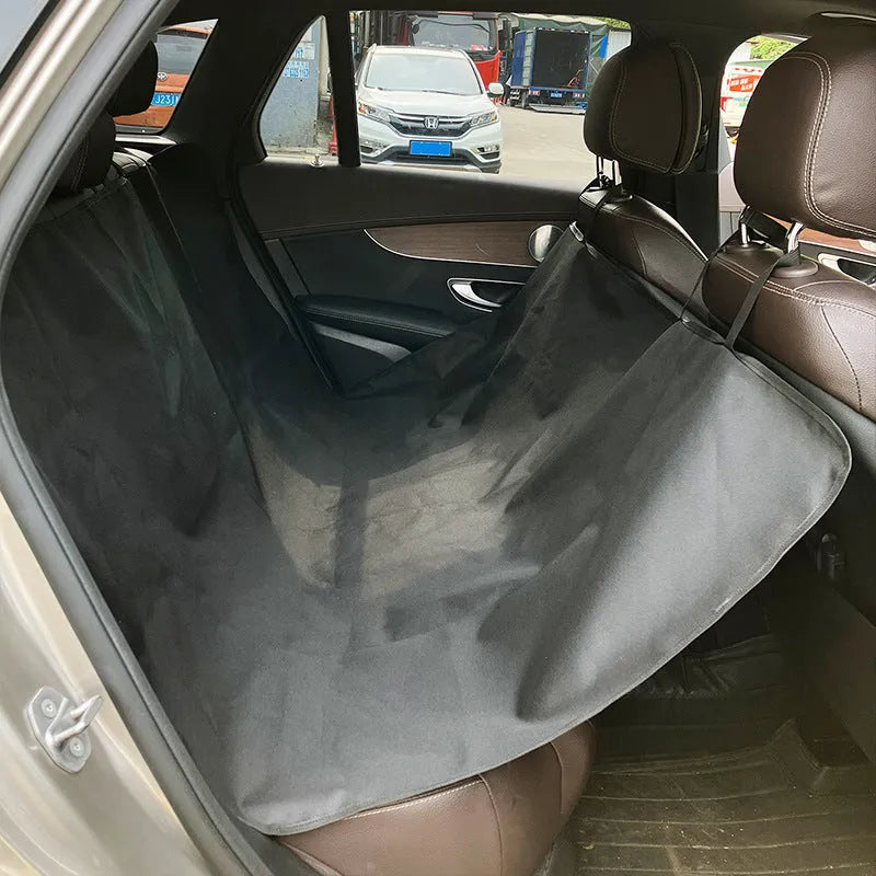 Car rear seat protector mat for dogs in cloth material with water resistant properties