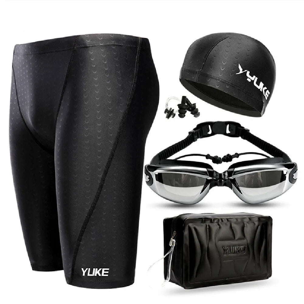 Men's black swimming set with trunks, anti-fog goggles, waterproof cap, ear plugs with nose clip, and carry bag