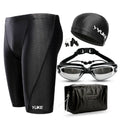 Men's black swimming set with trunks, anti-fog goggles, waterproof cap, ear plugs with nose clip, and carry bag