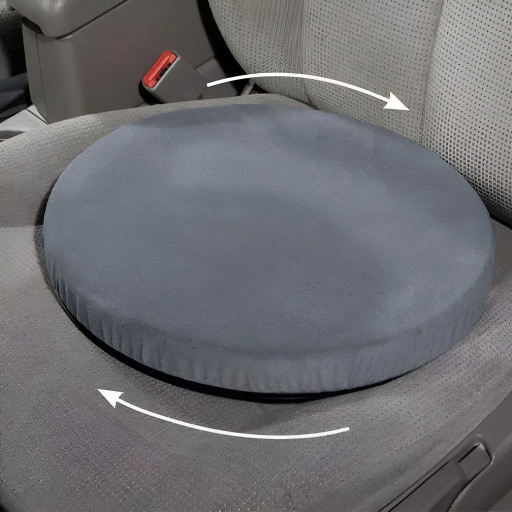 Grey rotating car seat cushion with non-slip base on a car seat.