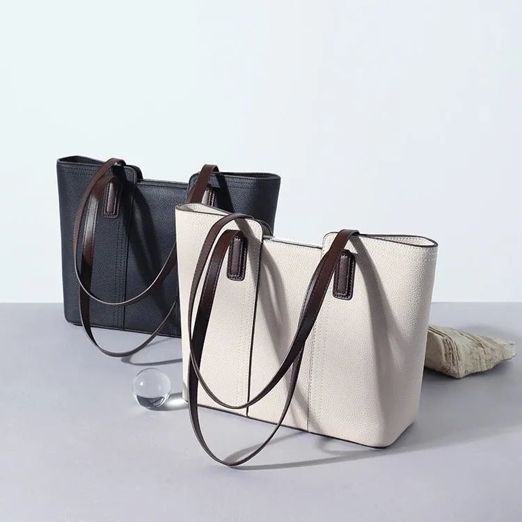 Genuine leather box-type shoulder bag in khaki colour with a sewing line detail and sandwich pocket.