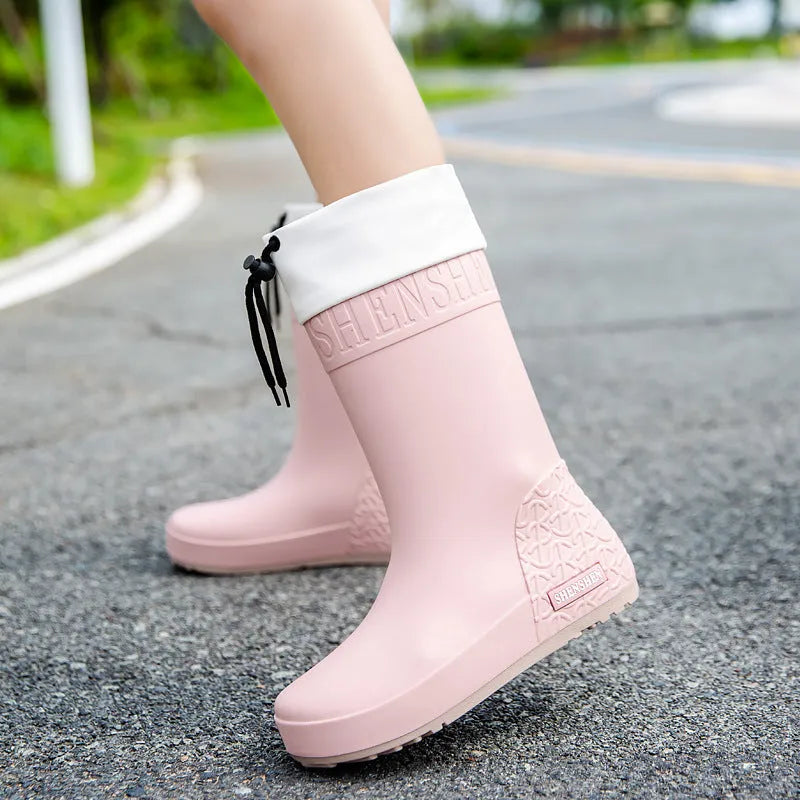 Women's solid colour PVC rain boot in apricot, featuring a non-slip sole and waterproof mouth design.