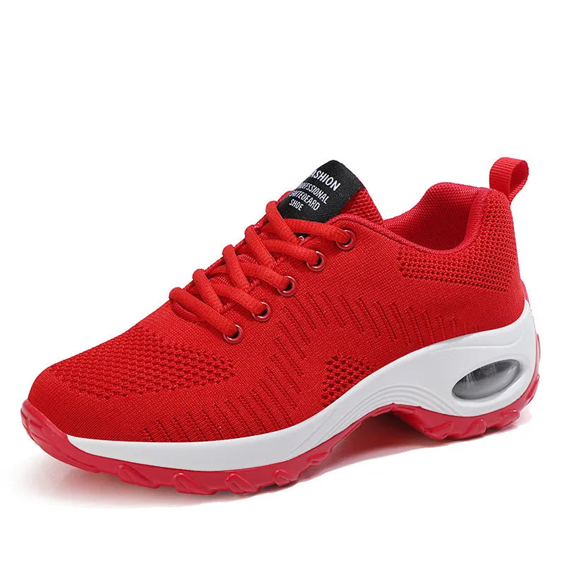 Women's round toe red mesh sneakers with white laces and a platform sole on a white background