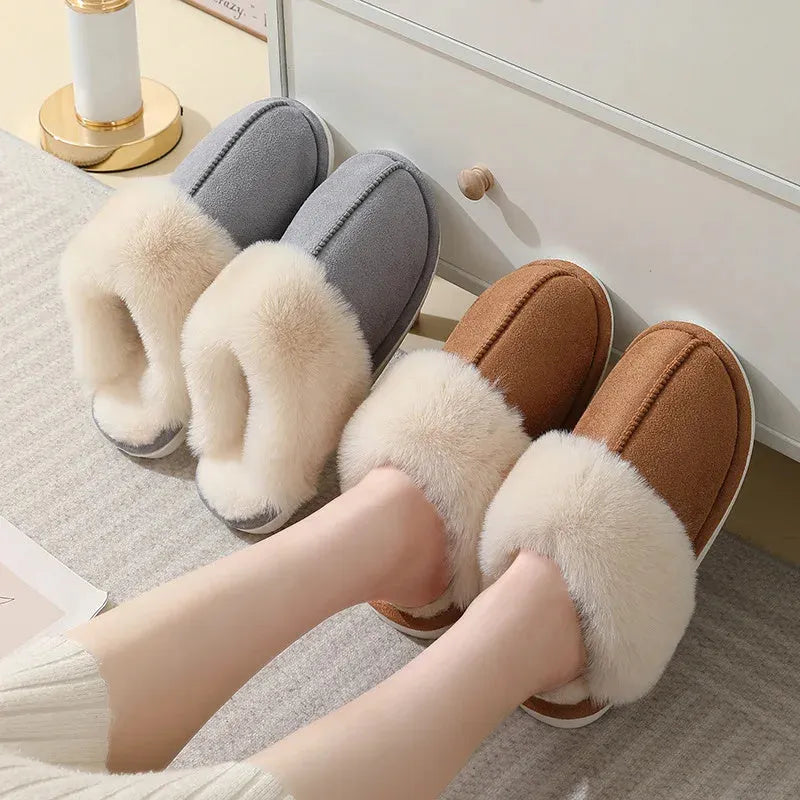 A pair of round-toe flat-heel plush slippers with stitching detail, shown in one of five available colours.