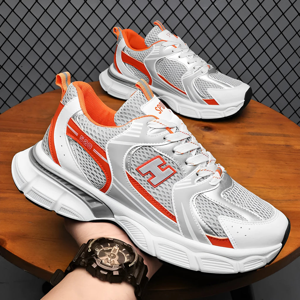 Men's solid colour mesh running shoes with a plastic sole, shown in black, white and grey, and white and orange.