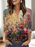 Women's loose fit V-neck t-shirt with a colourful 3D printed pattern, on a hanger.