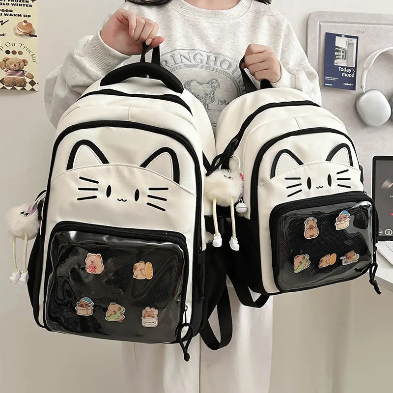 Korean cartoon pattern large backpack in multiple colours with curved straps and badge pendant option.