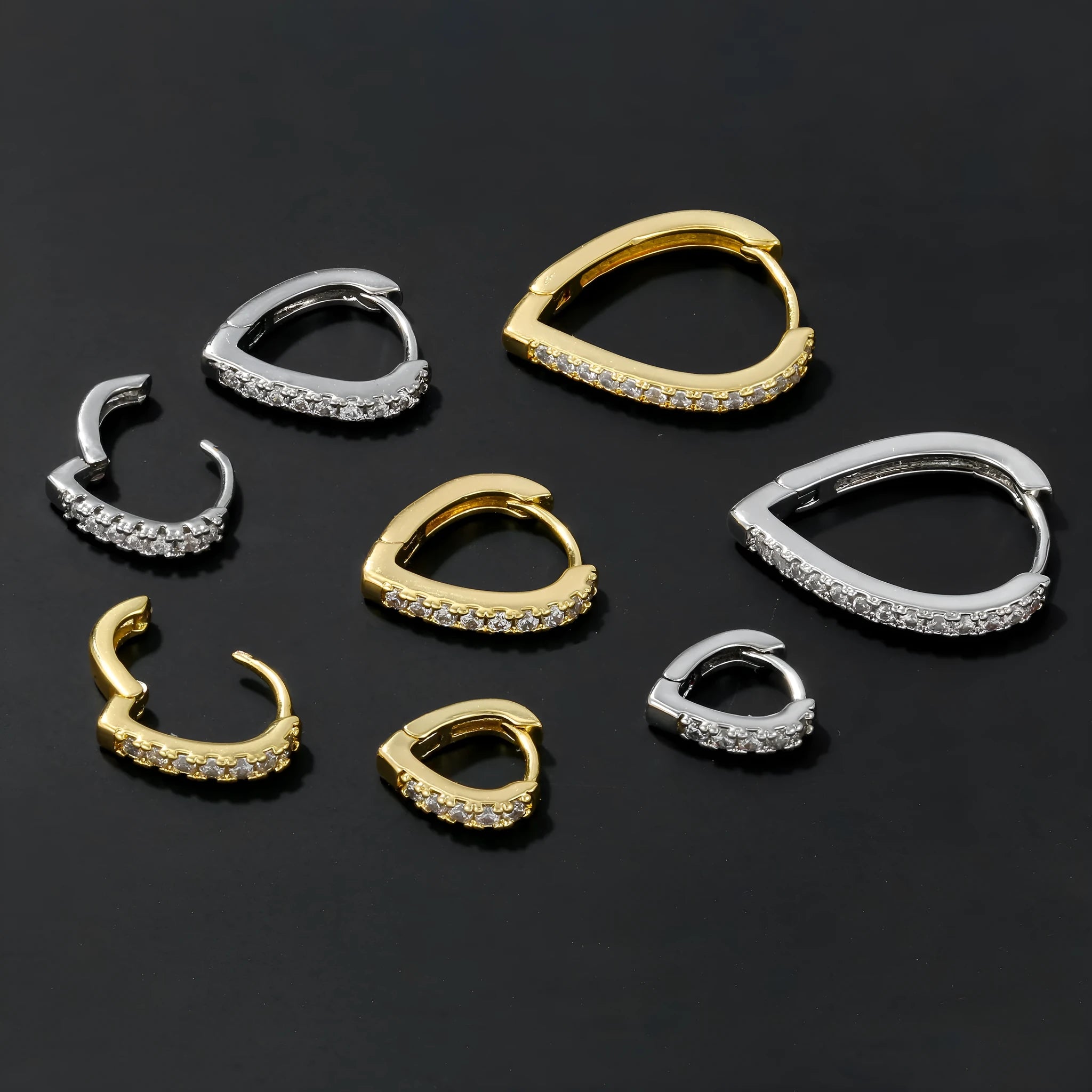 Geometric copper love ear clip with electroplated gold finish and heart design.