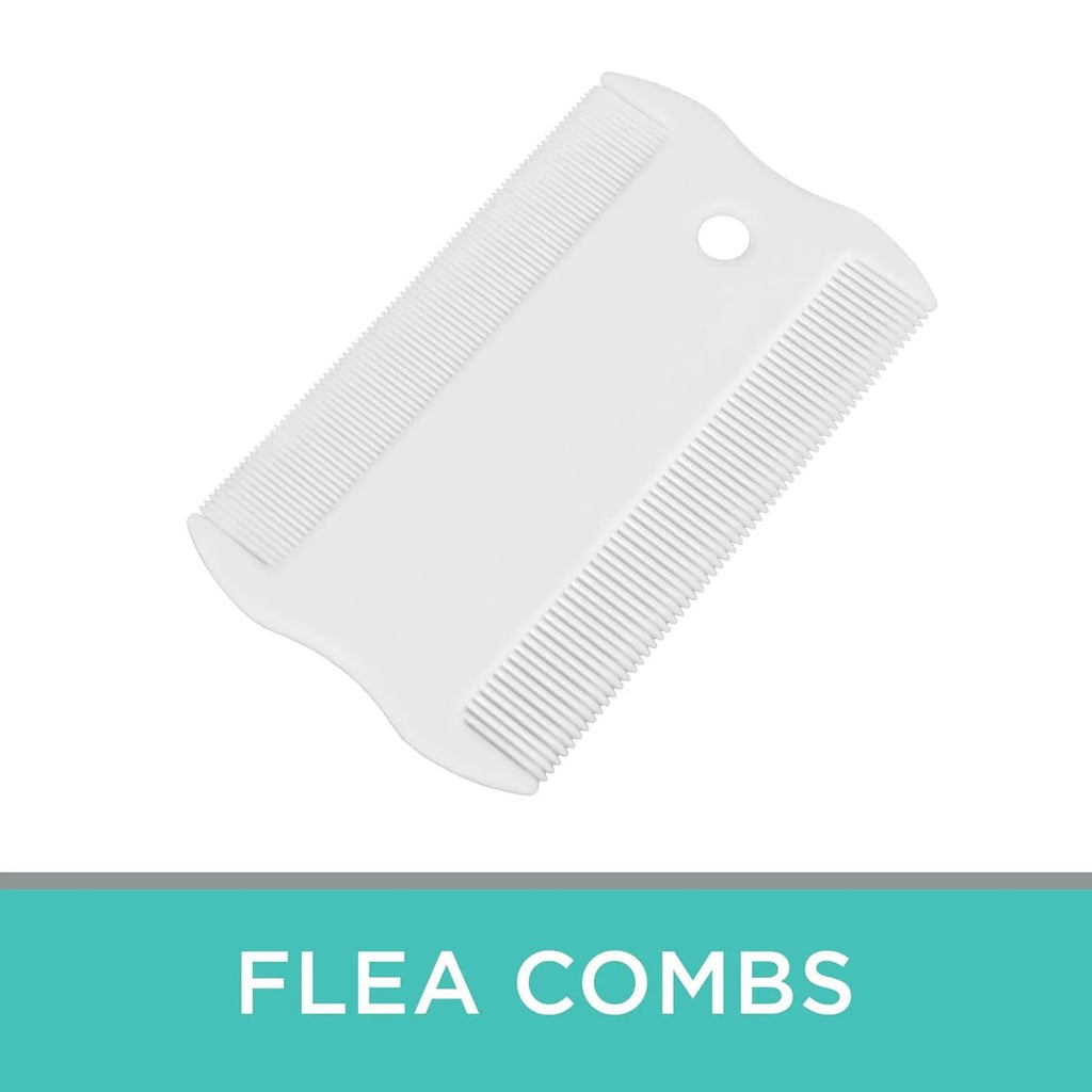 Small white plastic flea comb for pets with double-sided dense teeth, shown next to a ruler for scale.