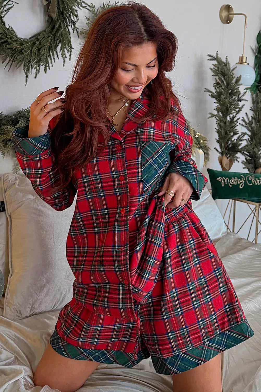 Red plaid Christmas pyjama set with contrast patches showing long sleeve shirt and shorts