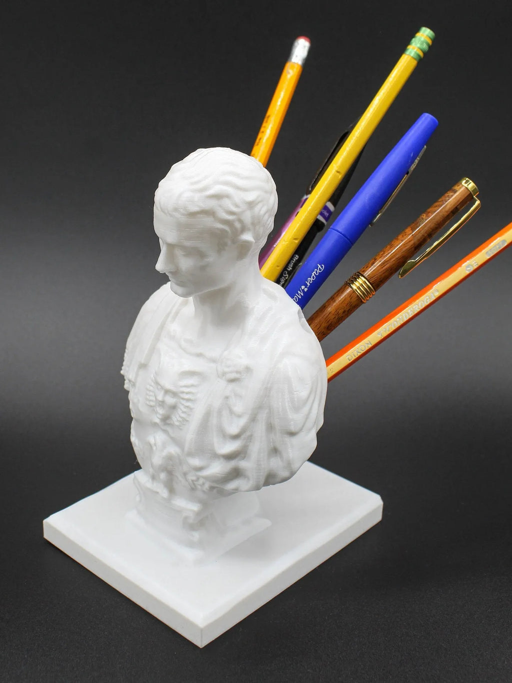 White American creative character model synthetic resin pen holder on a desk.