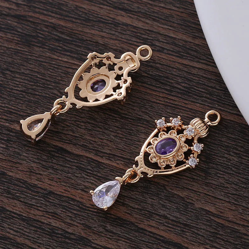Copper crown-shaped hollow water drop pendant with micro inlaid zircon in five colour options.