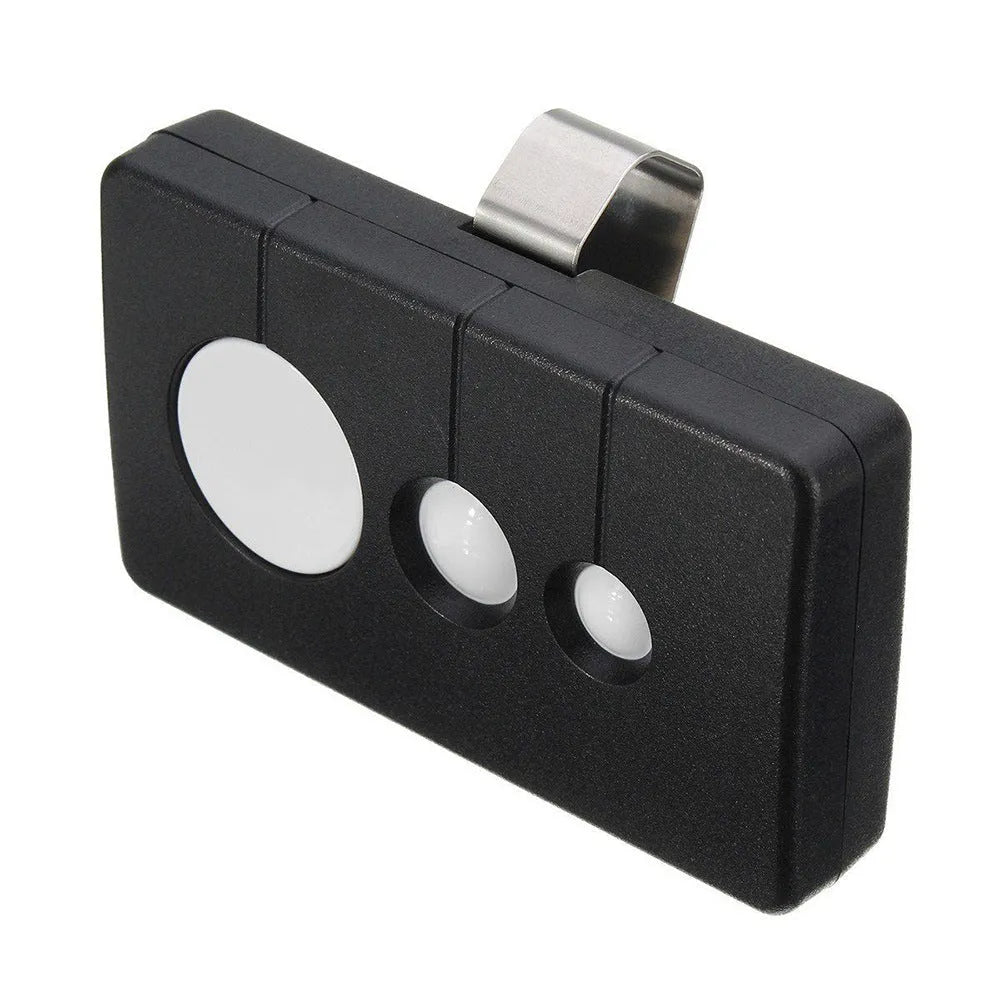 Black three-button garage door remote control with keyring loop next to a CR2032 battery.