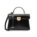 Black leather women's shoulder bag with vachette clasp showing horizontal square shape and adjustable strap
