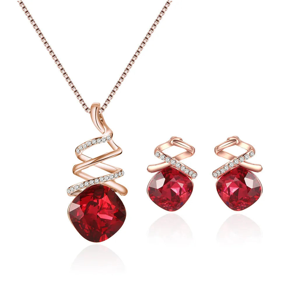 Alloy bridal jewellery set with water wave chain necklace and matching earrings on white background.