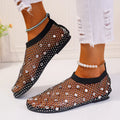 Women's flat sandals with mesh upper, colourful rhinestone detail, and a round toe.