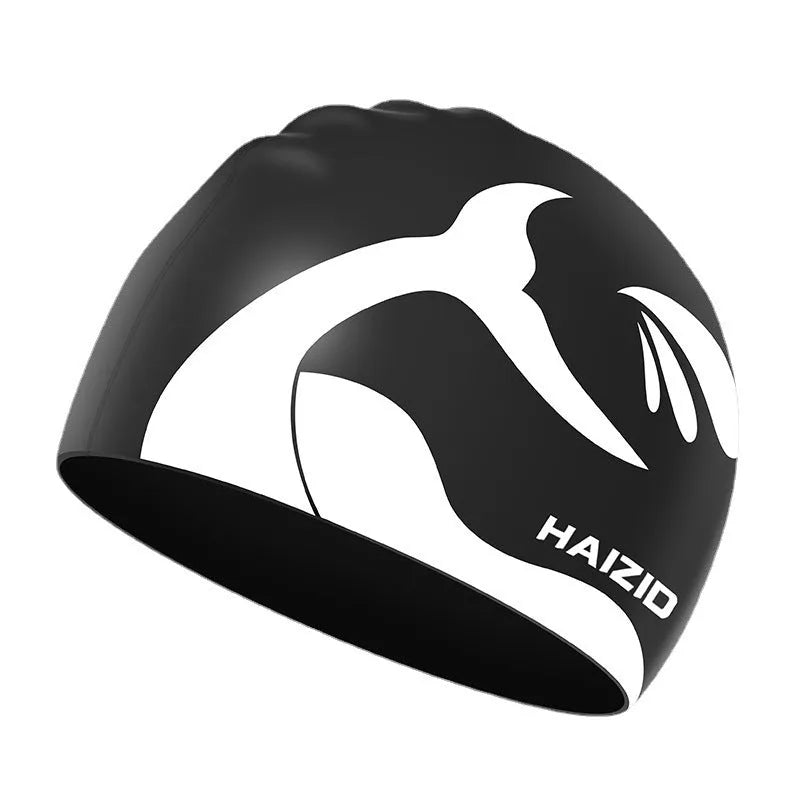 Silicone swimming cap with raised whale tail pattern and integrated ear protectors in multiple colour options