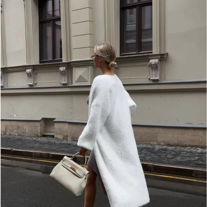 White women's knitted cardigan jacket with extended length and loose fit
