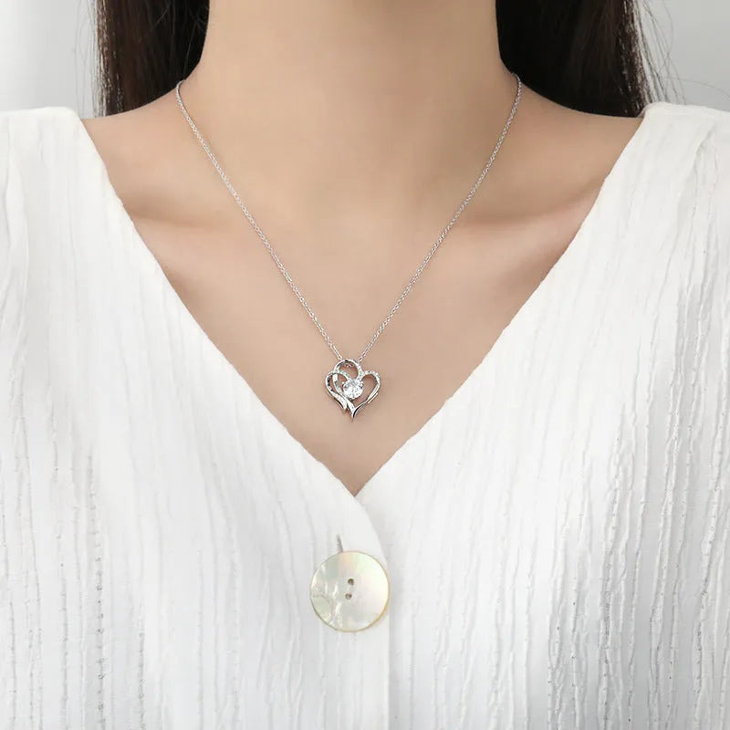 Women's sterling silver heart pendant necklace in rose gold, white gold, or yellow gold plating on a delicate chain.