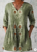 Women's printed loose wave dress with 3/4 sleeves and a wide waist on a hanger.