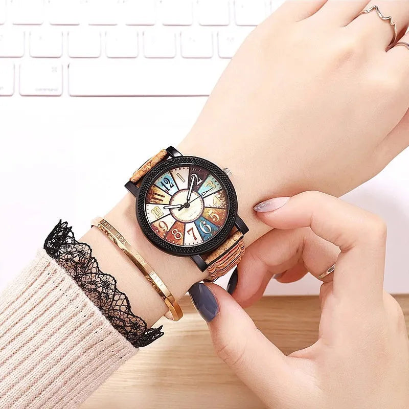Women's vintage-style quartz watch with brown leather strap and round silver dial