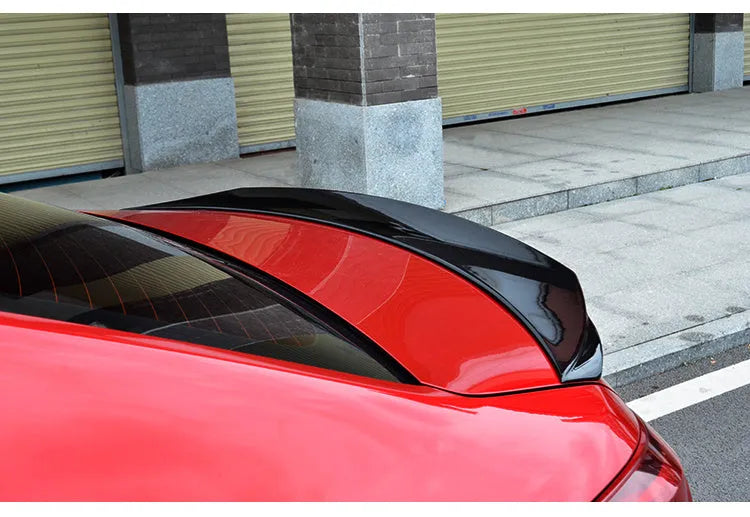 Mazda 3 Exela modified tail trim in bright black finish - large fixed wind-surrounded blade spoiler