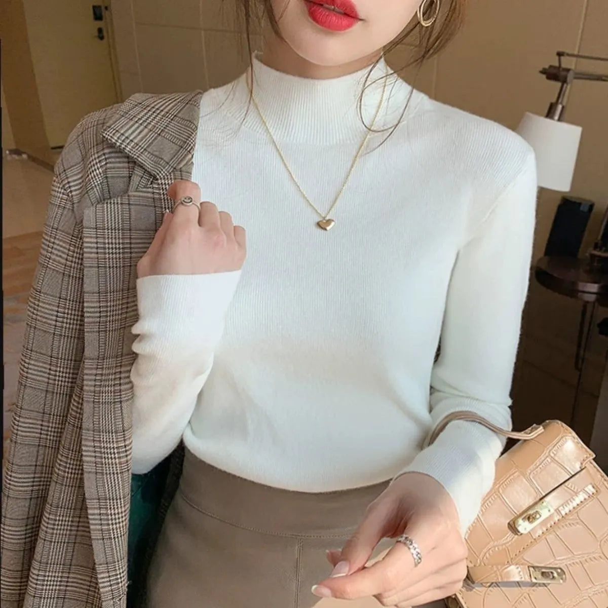 Women's slim fit viscose long sleeve top in apricot colour, showing front view.