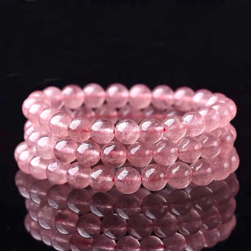 Women's strawberry quartz bracelet with 6mm, 8mm, and 10mm polished crystal beads