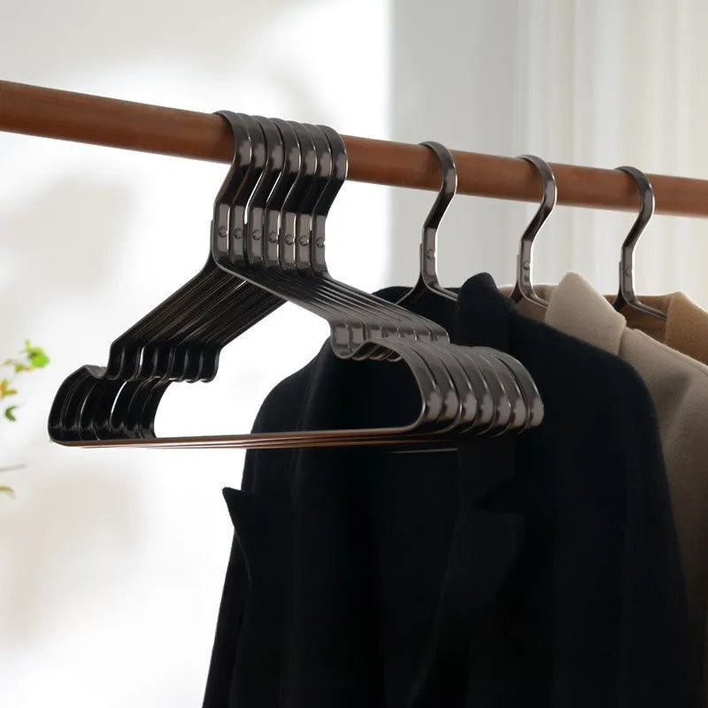 Elegant black modern minimalist clothes hanger with anti-slip coating.