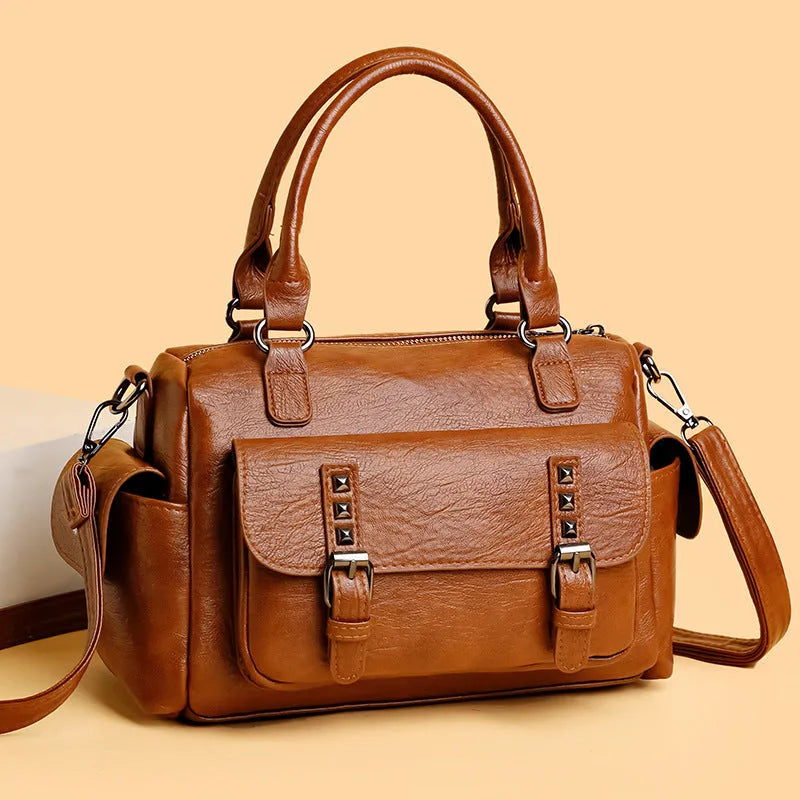 Vintage style square messenger bag in PU leather with visible stitching, shown in multiple colour options.
