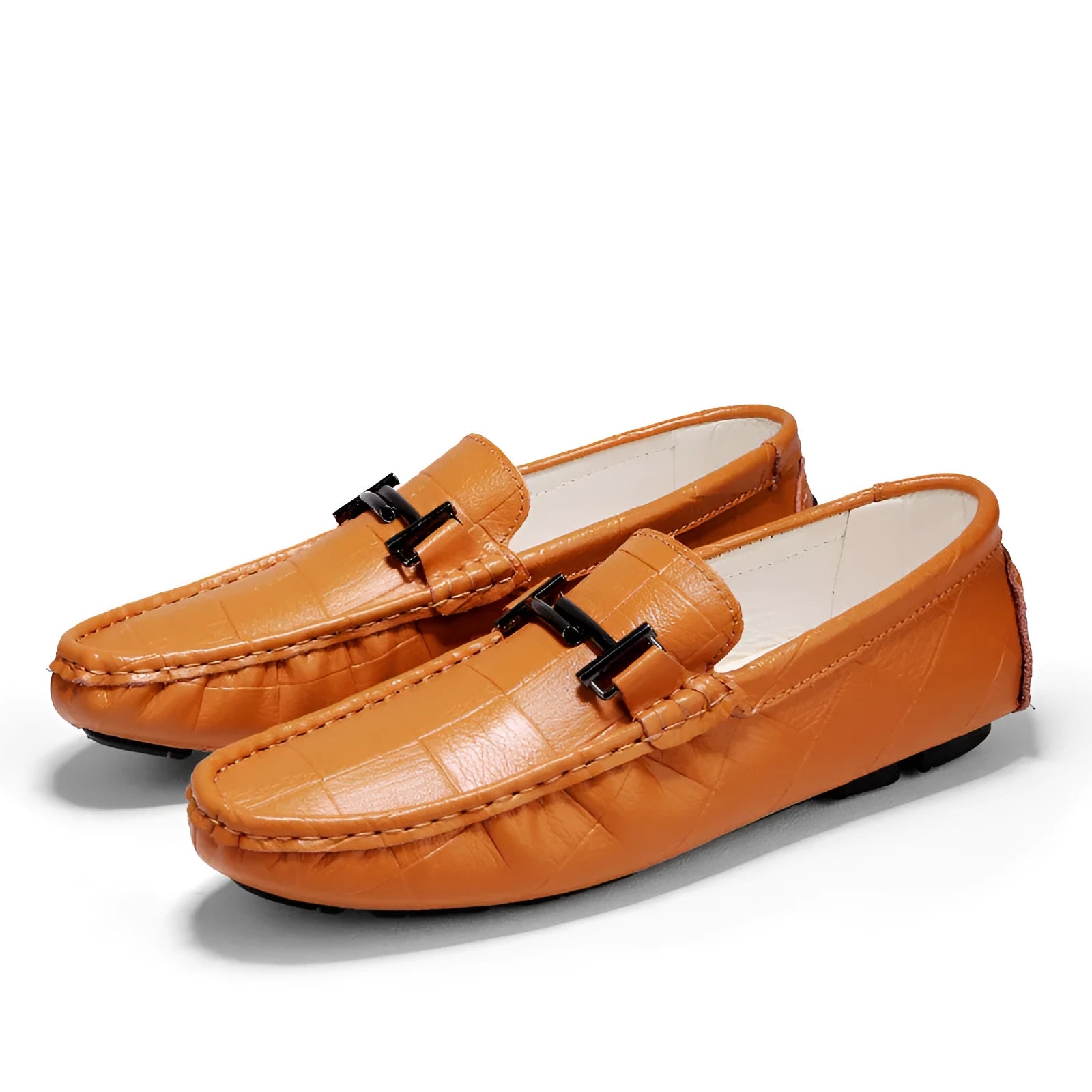 Men's black leather casual shoes with a metal belt buckle on the front and a flat rubber sole.