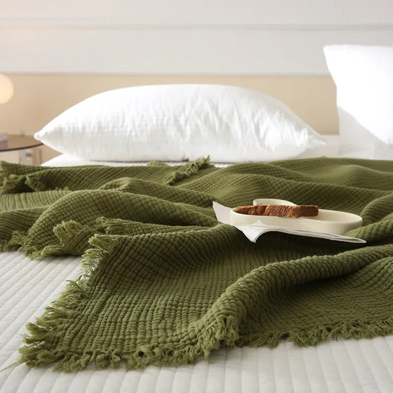 Four-layer cotton gauze blanket with tassel edge in a choice of ten colours.