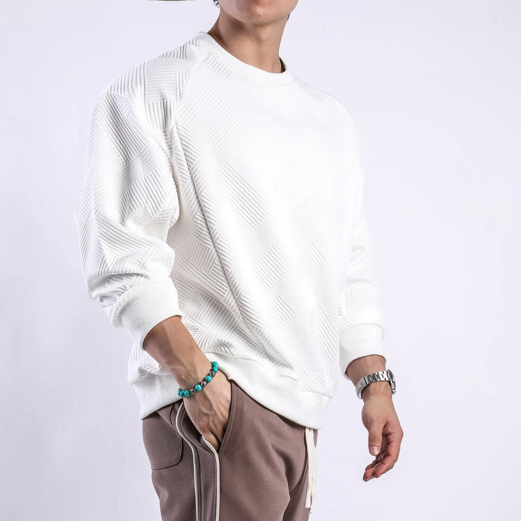 Men's solid colour twill jacquard long sleeve pullover sweater on a hanger.