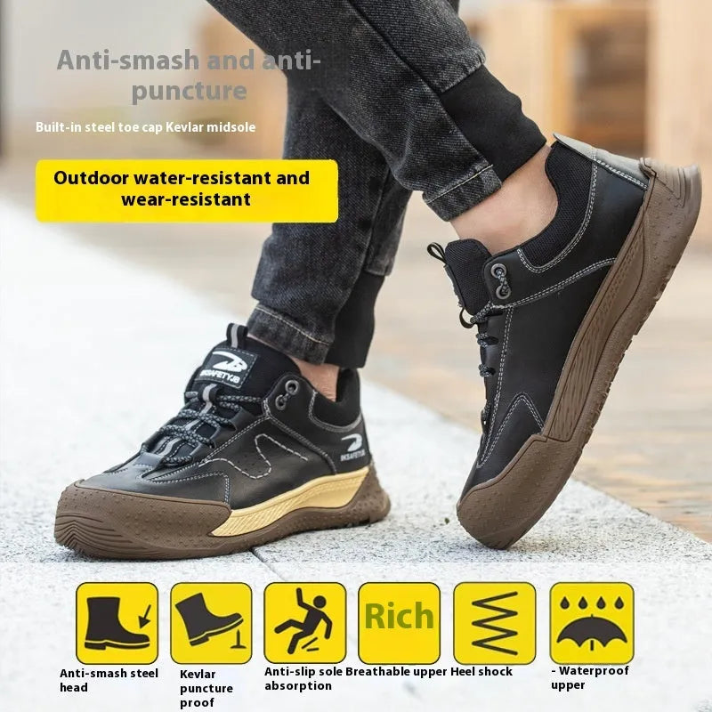 Men's black leather work safety shoe with Flyknit panel and rubber sole on a grey background.