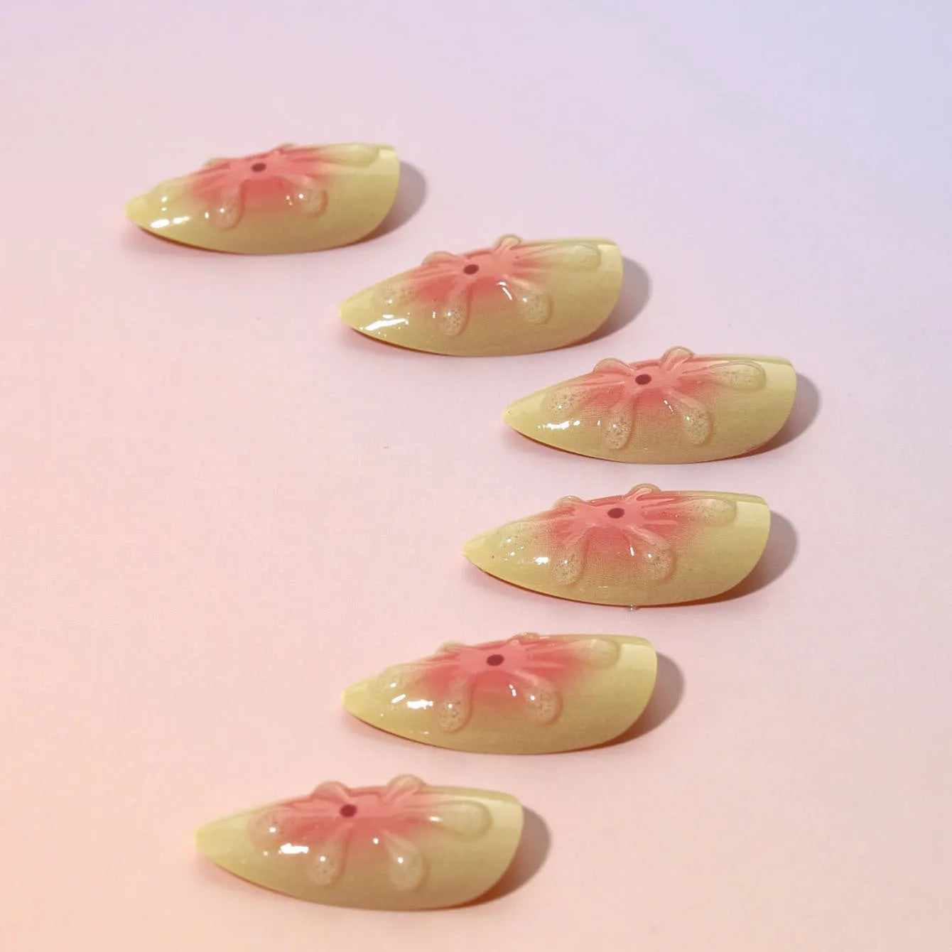 Cartoon-style 3D flower press-on false nails with detachable armour pieces, jelly glue, and a file.