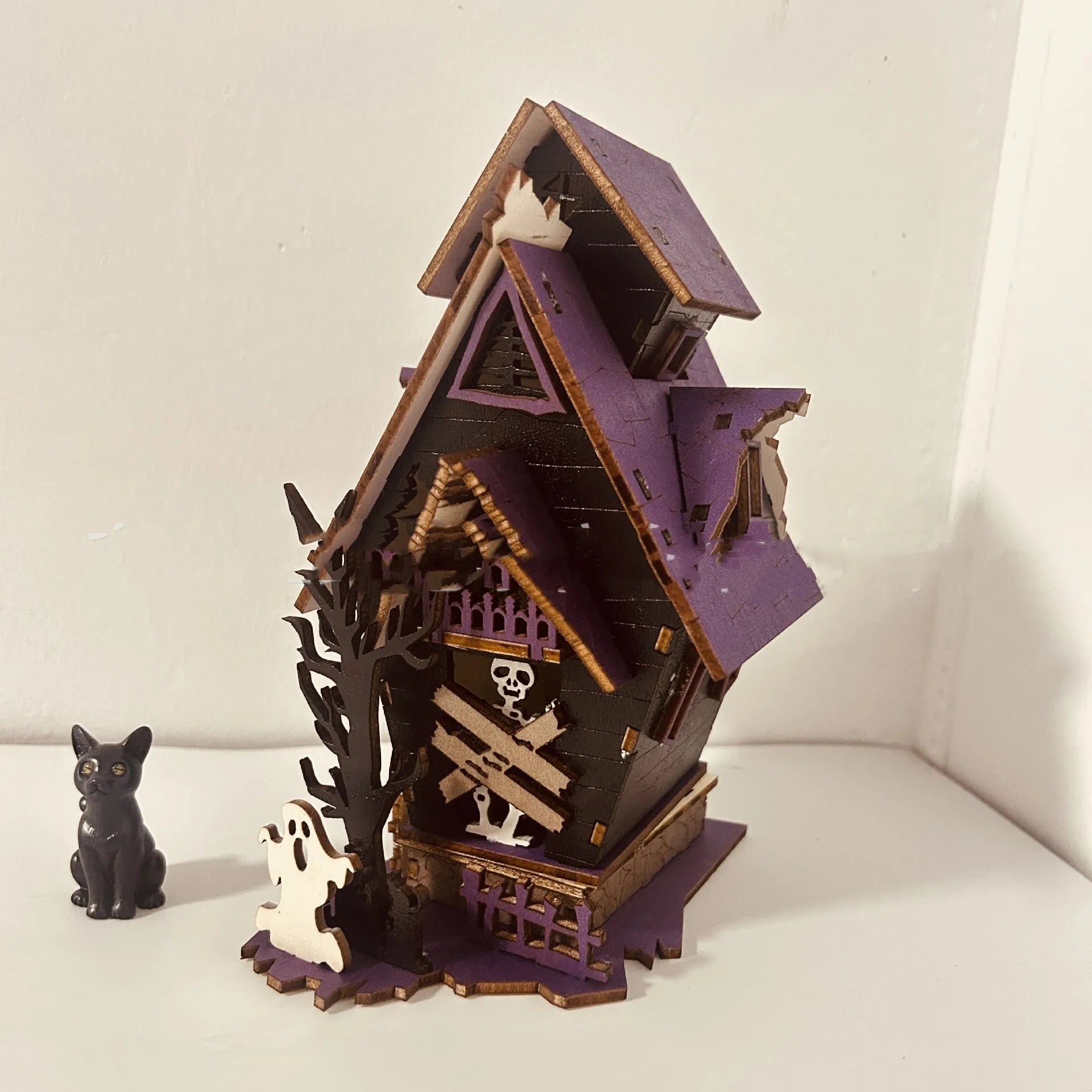Wooden Halloween haunted house decoration with luminous finish on tabletop