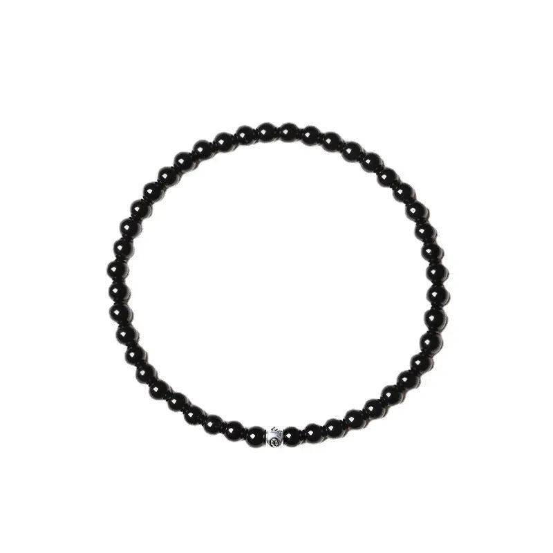 Geometric agate bracelet with mixed stone beads in black, blue, and obsidian colours