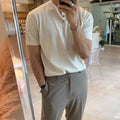 Man wearing a thin black short-sleeved ice silk knitted pullover shirt with a slim loose fit.
